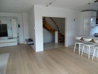 Neu verlegter Parkettboden in Wohnzimmer von WyDa Woods GmbH